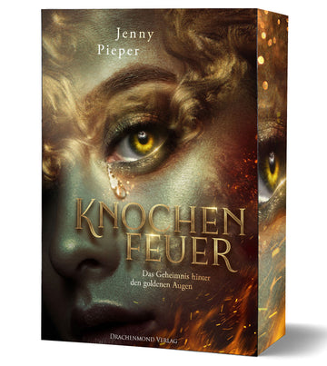 Das Produktbild zeigt die Nahaufnahme eines weiblichen Gesichts. Die Frau hat goldene, glänzende Haut und gelbe Augen. Es läuft eine Träne aus dem Auge heraus. Das Gesicht ist mit goldenen Locken umrahmt. Der Titel und der Autorinnenname stehen in der unteren Hälfte des Covers. Neben dem Titel sind einige Flammen abgebildet.